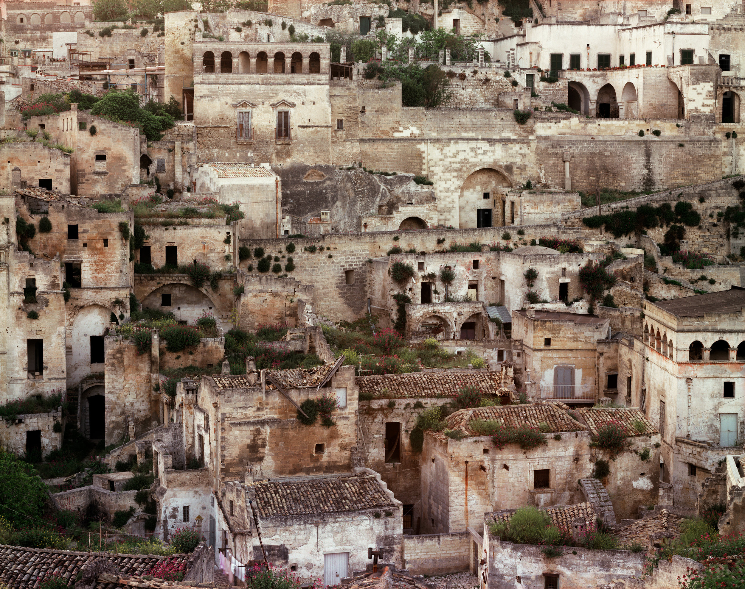  Caves used as dwellings since prehistoric times, modifies with tufa facades, now under restoration, Matera, Italy, 1994 