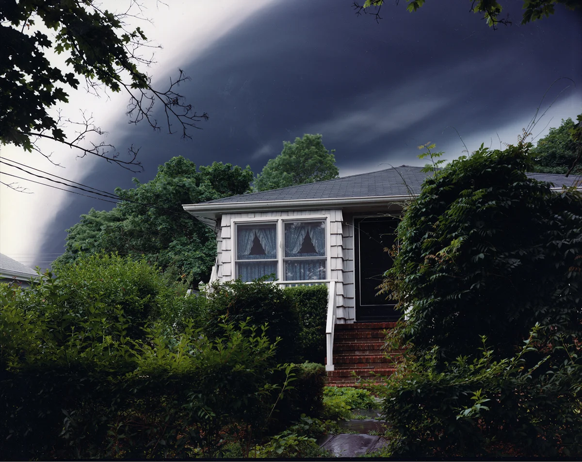 Evacuated house and smoke from three million gallons of gasoline burning in a Shell oil fuel tank struck by lightning, Woodbridge, New Jersey, 1996