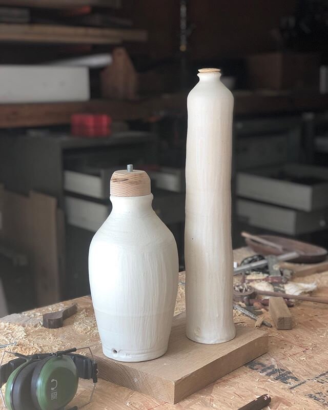Sizing and deciding...⁣
⁣
Spending some time in our wood shop working on the wooden stem of these beauties 😍. ⁣
⁣
The shorter lamp is in porcelain with alabaster glaze, the taller in our standard stoneware.  Both stems will be made from a local ash 