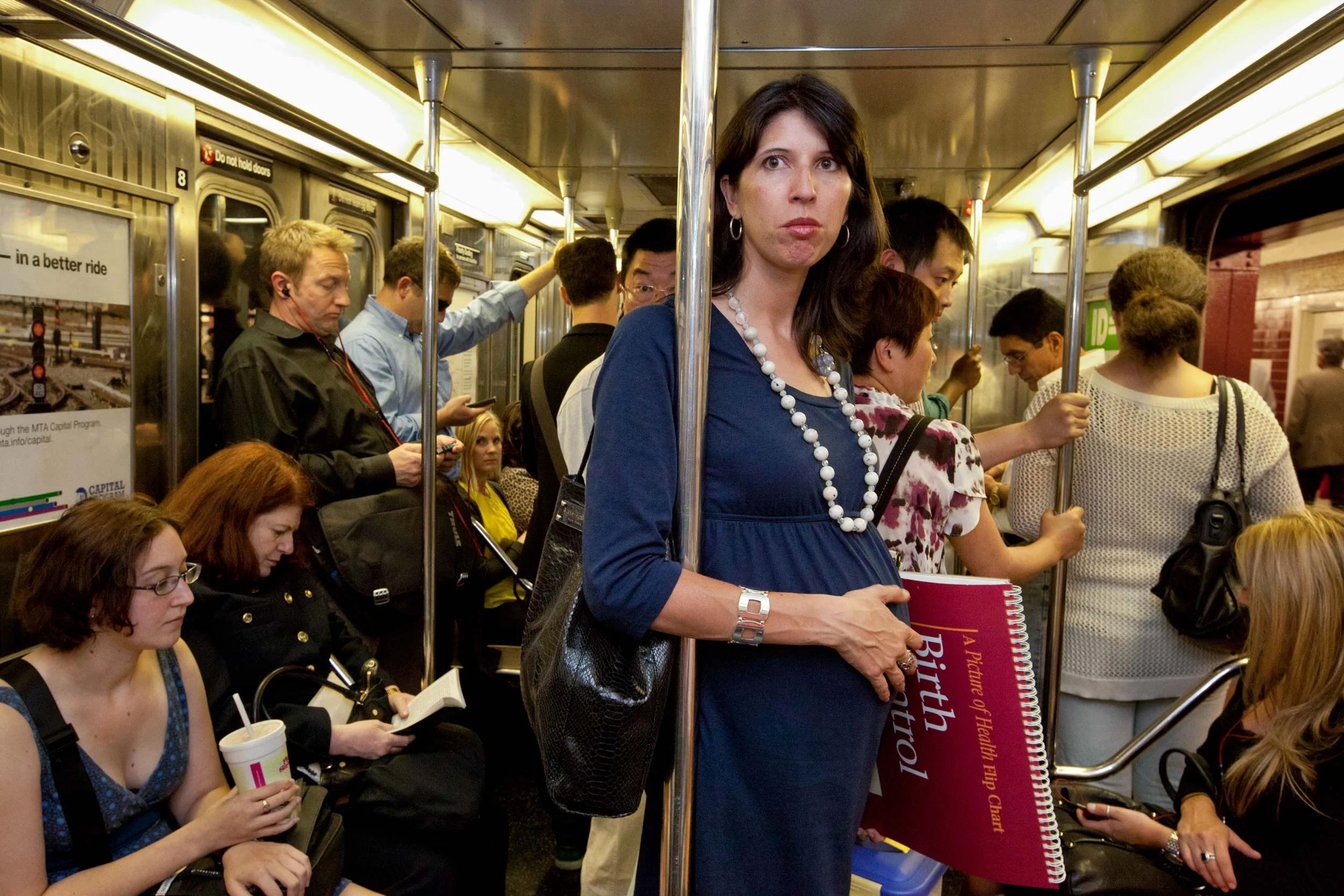showing-pregnancy-subway-lori-grinker.jpg