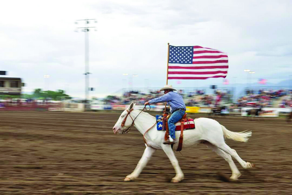 Bryce and White Trash presenting the American Flag at Bishop Mule Days