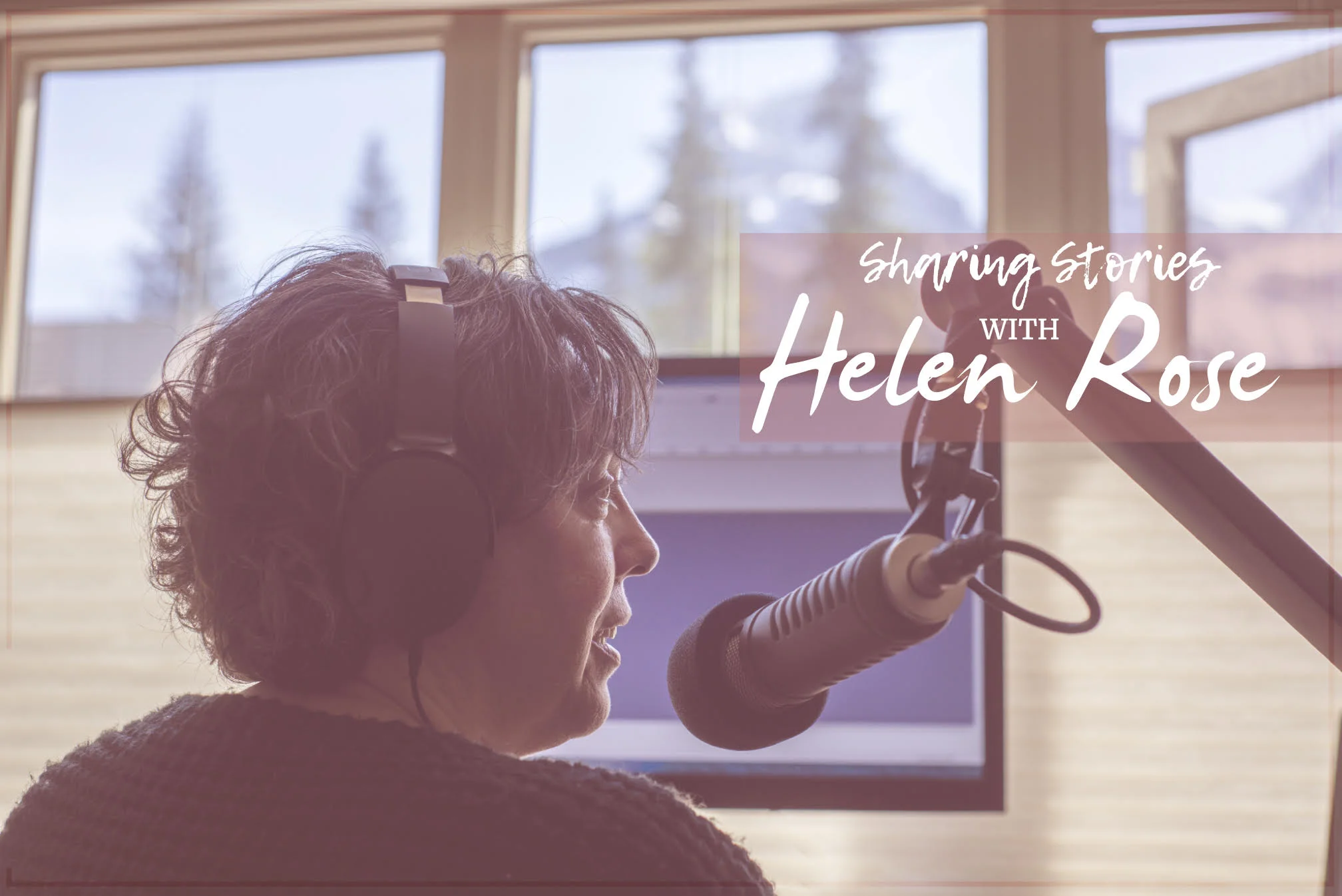 Helen Podcasting with Mountains in the backdrop.jpg