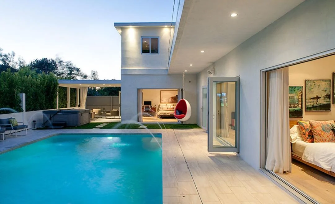 7470 Woodrow Wilson Drive | Hollywood Hills SOLD! $2,500,000 Completely remodeled bright contemporary nestled in the hills on Woodrow Wilson's "celebrity row." Following a total renovation, light wire brushed oak floors throughout compliment this beautiful, light-filled home's crisp modern design and high ceilings. An open floor plan upstairs is lined with bifold doors to a balcony overlooking the backyard and includes a kitchen with Modulo Cucine glass cabinets and Thermador appliances, dining area and living room with a fireplace. 4 bedrooms with en-suite baths including a luxurious master suite with his and hers closets, a spectacular bathroom with a double head shower, and bifold doors to the pool deck. Resort-like south-facing backyard gets sun all day and boasts a covered patio with an outdoor TV, and finishes such as recessed lighting, Athena Pearl tile, Crestron home automation, and a wine cellar complete this beautiful hillside hideaway.