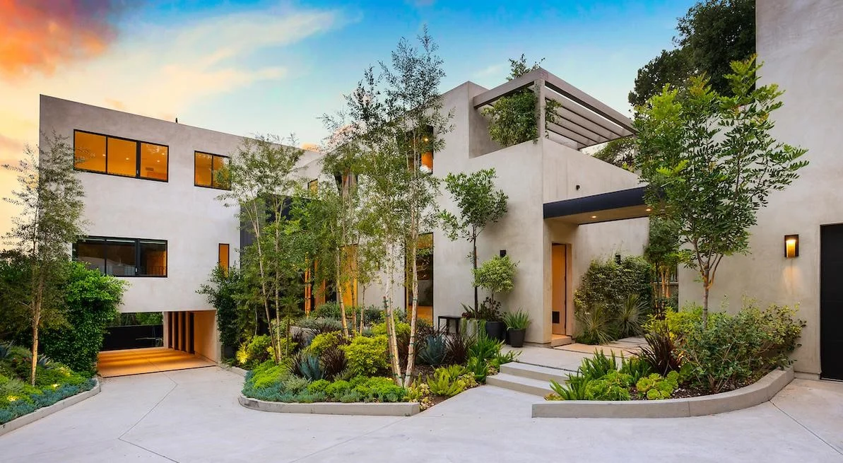 1317 Delresto Drive | Beverly Hills SOLD! $13,450,000 One of the most private compounds minutes to the Beverly Hills Hotel. Gated warm contemporary w/separate guest house at end of a cul-de-sac spread over a magnificent landscaped setting and exquisitely finished throughout. Impressive double-story foyer to living rm, dining rm and kitchen/ family rms all opening w/ Fleetwood glass doors for indoor/outdoor living. Chef's kitchen w/ Miele appliances and center island flows to breakfast rm, lounge seating area and an add'l outdoor breakfast area. Luxurious master of approx. 2,300 sq. ft. w/ beautiful city and ocean views, his/her baths and oversized dressing rooms w/ separate gym/ massage rm, sitting rm/office. Home theater, library, wine rm and multiple outdoor seating areas and decks surrounding the home's first and second floors. European oak flooring, custom lighting features, home automation system, a 3-car garage plus additional covered parking. A warm and timeless compound w/ unmatched privacy.