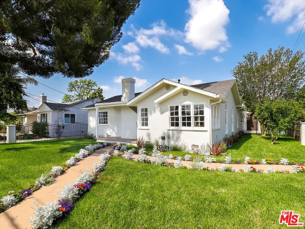6061 Shadyglade Ave | North Hollywood SOLD! $950,000 Beautifully renovated corner lot home with expansive front yard on quiet street in Valley Glen! This approximately 2,400 sf, 4 bed/3 bath (Assessor 2,288 sf, 3 bed/2 bath) open floor plan home combines classic character with all of the right new touches. Custom French windows and doors, and skylights provide lots of natural light throughout. Updated kitchen features stainless steel appliances, quartz counter tops and patterned cement tile floor. Featuring refinished oak floors throughout with step down family room with high vaulted ceilings. Formal living and dining room areas with separate office space and two wood/gas fireplaces. Large master bedroom with walk in closet and en suite bathroom opens to private, grassy backyard. The house is gated with beautiful newly installed landscaping. Lots of storage space throughout and in the garage. Close to beautiful community park and places of worship with easy access to freeway, shopping, restaurants and new Noho West development.