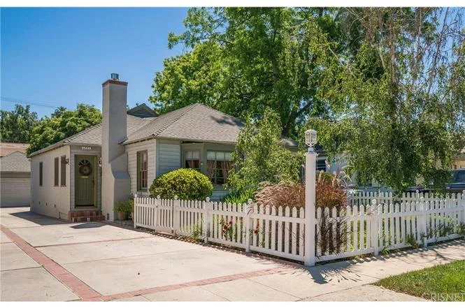 4664 Norwich Avenue | Sherman Oaks SOLD! $843,474 This Charming Cottage is located just blocks to Ventura, in a pretty setting with a white-picket fence & a long driveway that extends to the detached garage. The front entry opens to a small foyer; here you are greeted by gleaming hardwood floors and natural light that fills the craftsman styled interiors. The living room is large, anchored by a fireplace and large garden window. Adjacent is a well defined dining room, and the kitchen - which opens to both of these spaces and features; granite counters and updated cabinetry with a large efficient built-in pantry The main hall leads to the private wing. The 3 bedrooms are well sized for family or guests, but also is ideally suited for Office, Studio or Master, as it is currently configured. There are two adjacent updated bathrooms, 1 w/ pedestal sink and shower and 1 w/ large granite counter, subway tile and a step in tub/shower. To the back of the home is a permitted addition that includes a huge walk-in closet with dressing area and a laundry/utility room with tons of extra storage. The front yard is beautifully landscaped with bushes, a shady tree, and thick established grass. The rear grounds include the driveway area for parking or play, a large used brick patio that is perfect for al-fresco dine and grill, a grassy area that extends to the rear property line - dotted with fruit trees and well shaded areas, and an additional storage space behind the garage. This home is ideal for easy living, or possible future development.