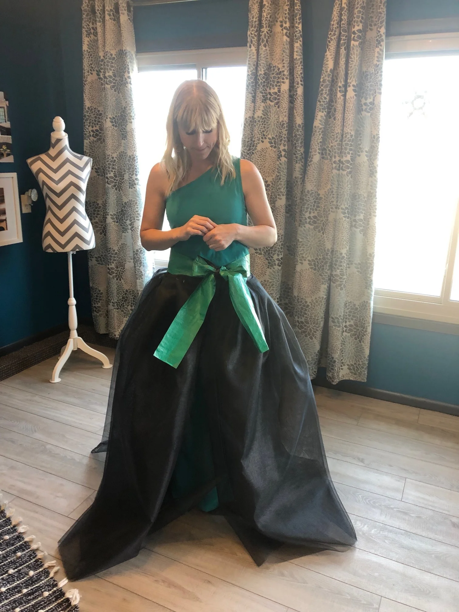 Playing around with the basic design and shape of the gown using layers of window screen and tarp to create an overskirt.