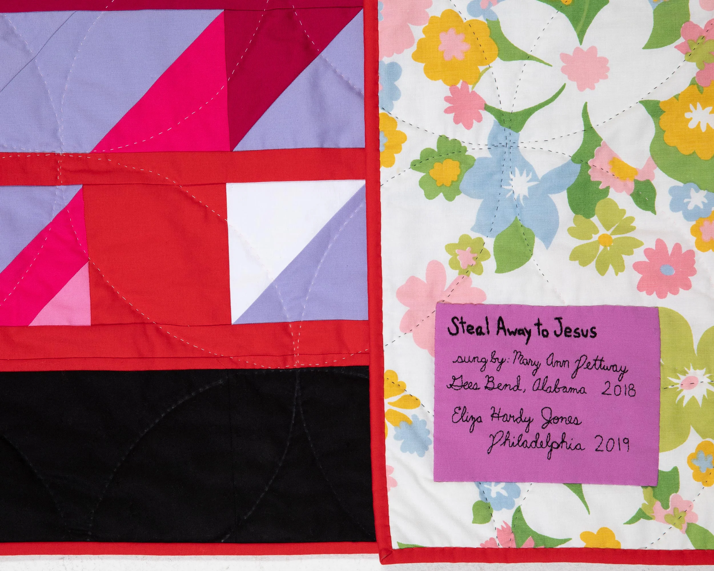 Scrap back with detail of hand quilting.
