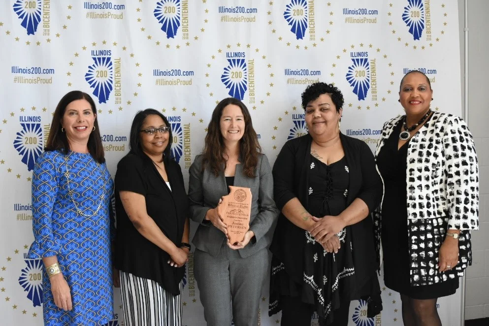 Justine PETERSEN was honored at the Illinois Department of Human Rights’ Fair Housing Celebration in April 2018