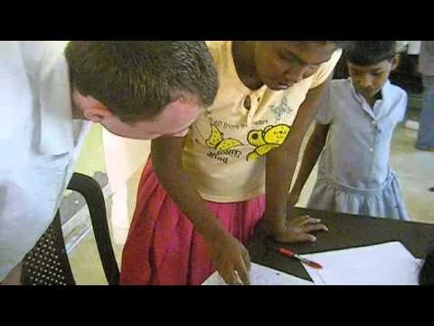 Sri Lankan orphans reading letters from US students (Copy)