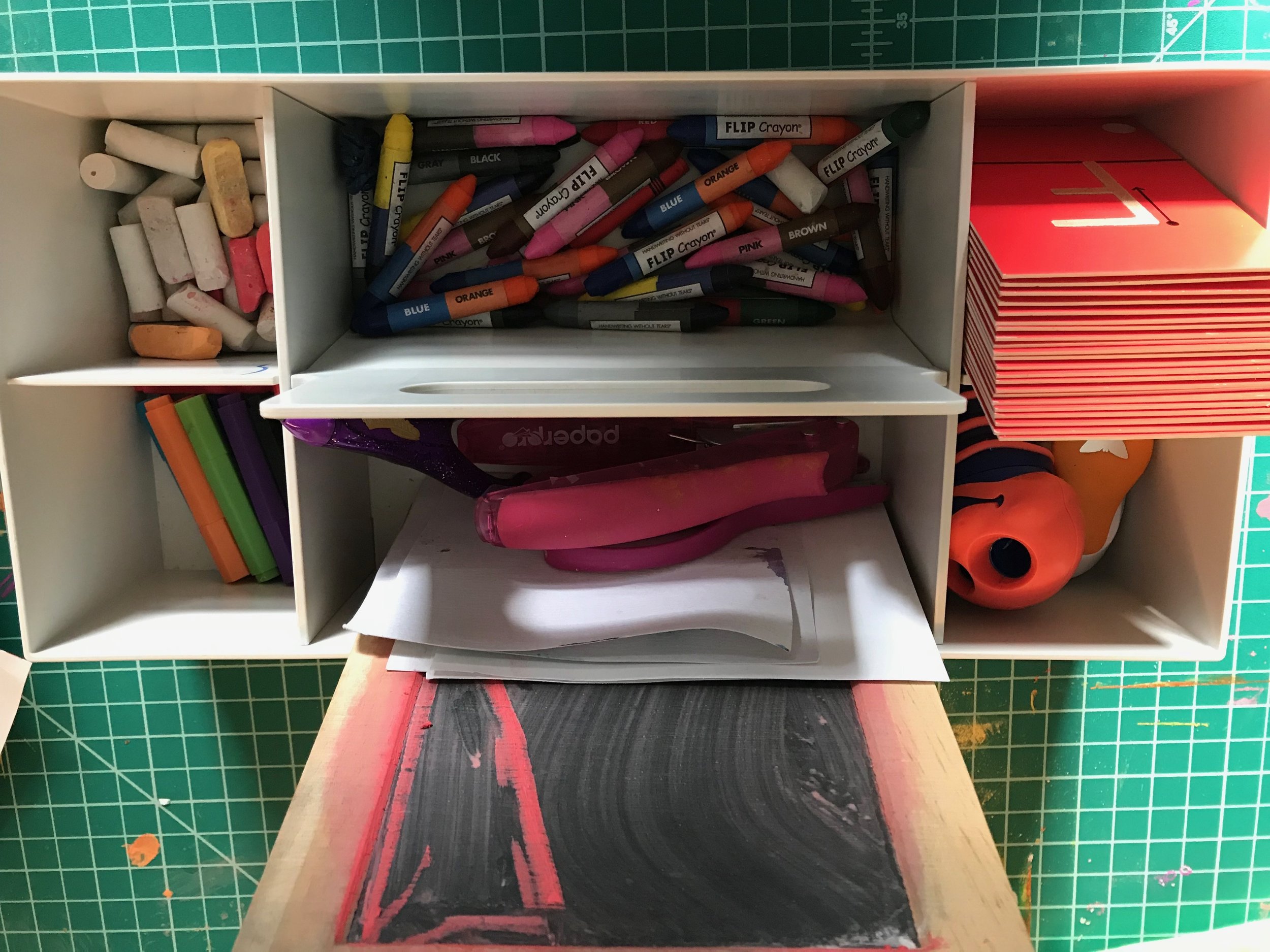 EARLY WRITING BIN Materials: Short crayons and chalk bits from Handwriting Without Tears , index cards, whole punch, Montessori sandpaper letters, chalkboard, small Muji markers Process: Create a bin with early writing supplies. Little hands write better with short pencils, chalk bits, and little markers ( Crayola makes them too ). Keep this accessible and let children self direct. Words: ABC’s, pinch, squeeze, trace, twist Questions: What can you make? What did you try? I wonder if? What can you try to do?