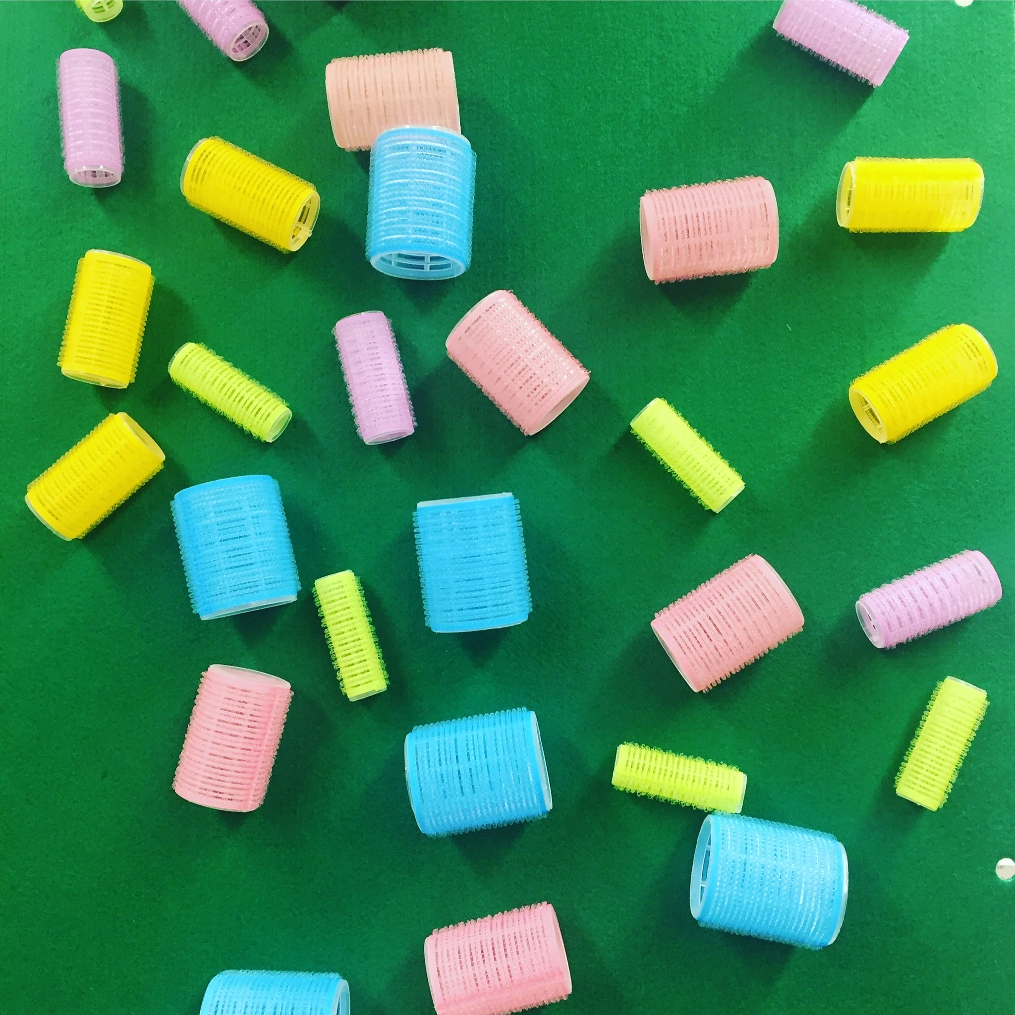 STICKY WALL Materials: flannel or felt, curlers, velcro Process: Stretch a large piece of flannel over a piece of foam core or wood and affix with staples, glue or nails. You can also just tape the flannel to an easel or the wall. Experiment with things that stick to flannel—like other flannel pieces, velcro, and curlers! Words: stick, fall, gravity, shape words, texture words Questions: What will happen next? What if we…? Why does it stick?