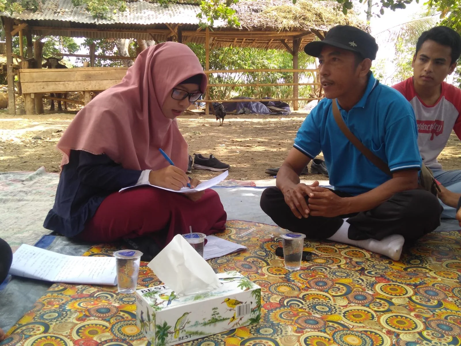 Field Officer Ms Baiq Ria Askina (L) interviewing a Dinas staff member, Pendua village, Lombok, September 2019.