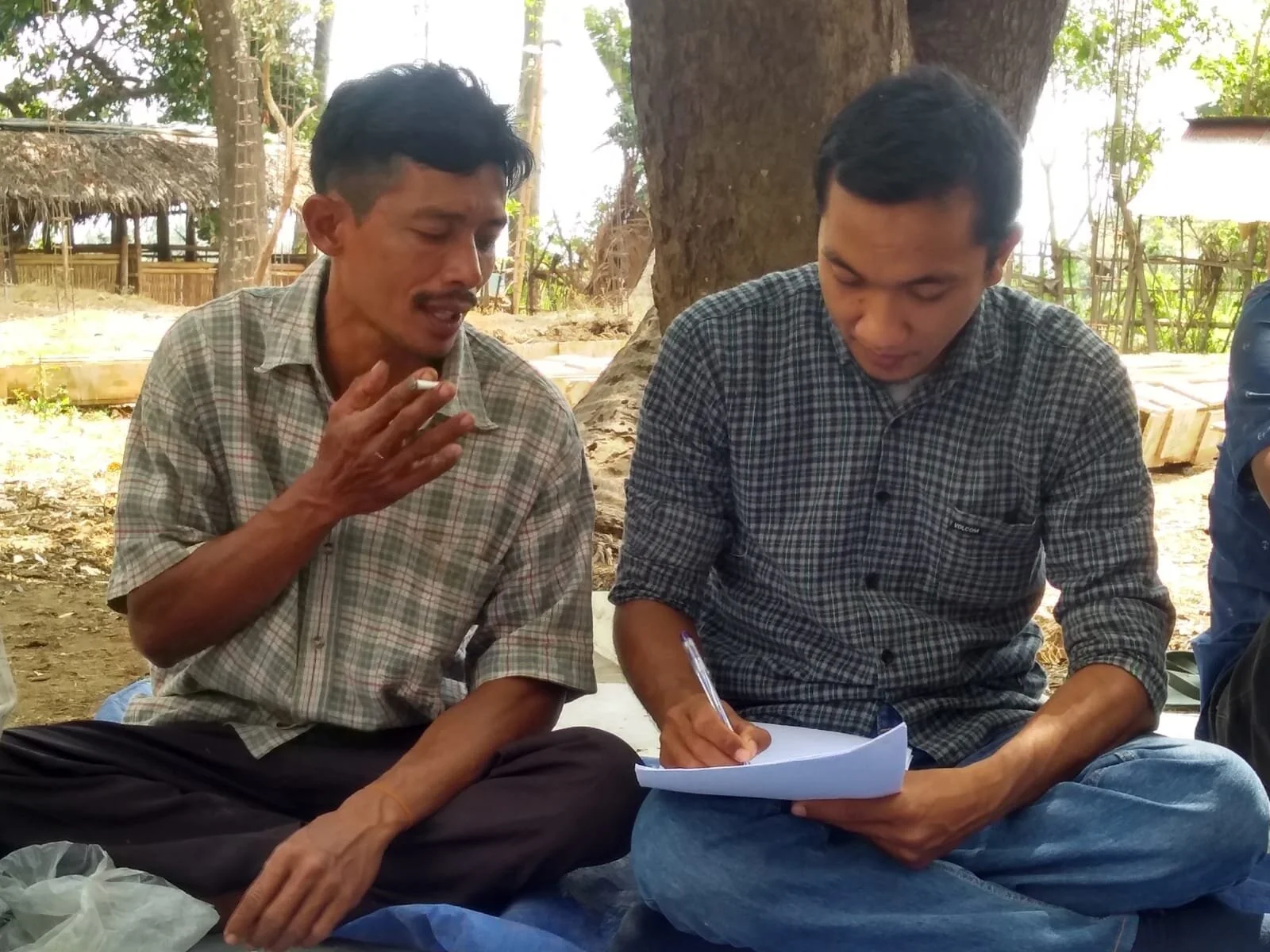 Field Officer Mr Muhamad Sukri (R) conducting an in-depth farmer interview during scaling research training, Pendua village, Lombok, September 2019.
