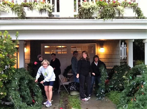 Helping clean up the wreaths for decoration for the city.