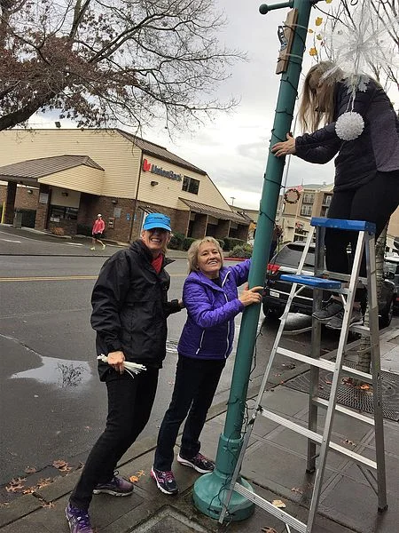 Helping installing the christmas lights.