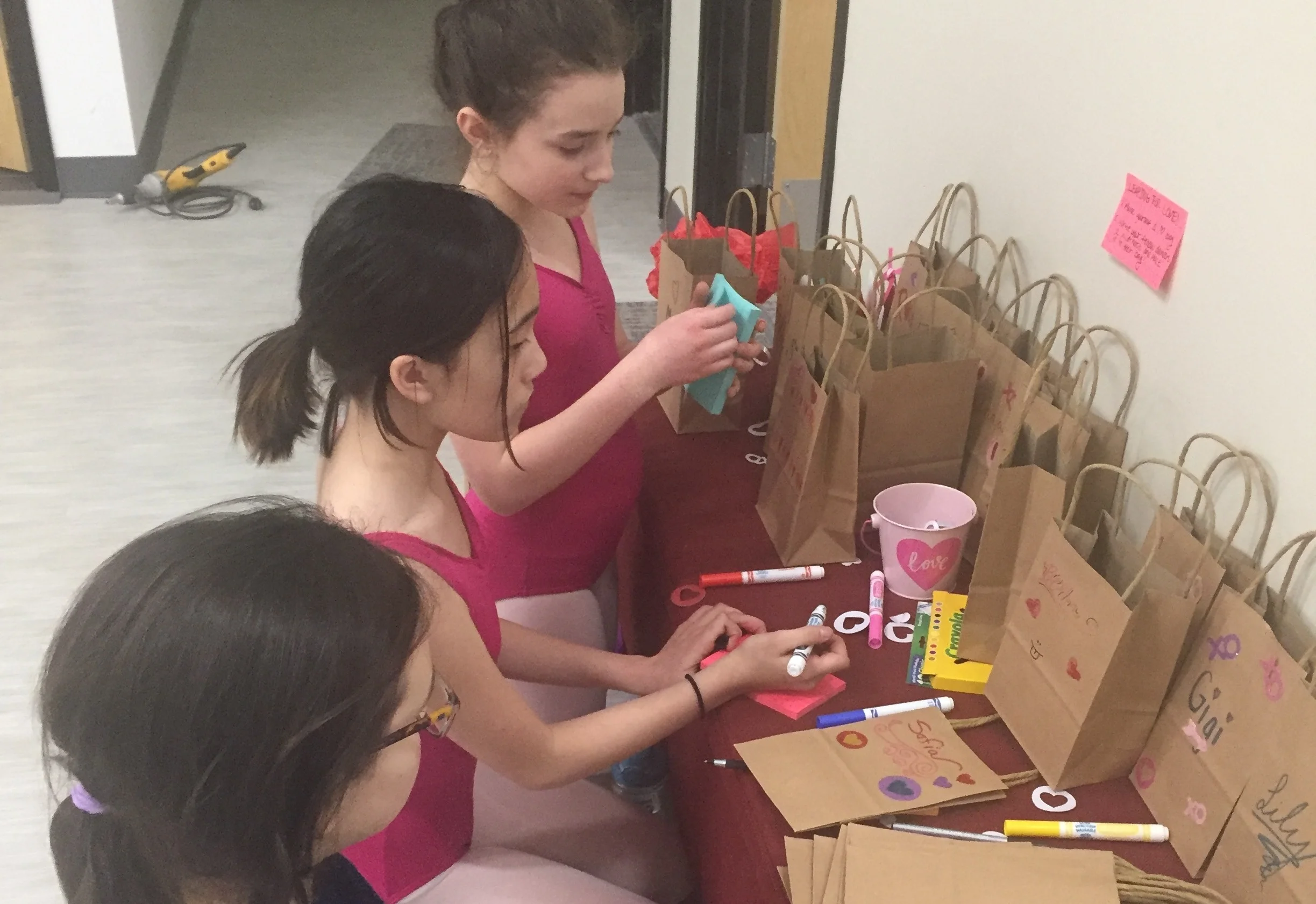Students writing valentines to their fellow dancers and mentors