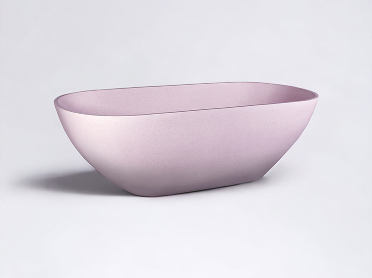 Three quarter view of our Renoir Stone Composite 1700mm Bath in pink colour