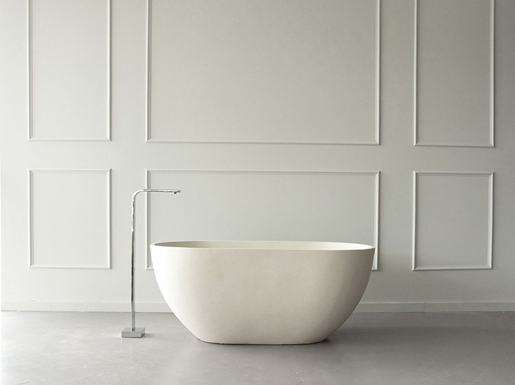 In situ view of our Renoir Stone Composite 1200mm Bath in limestone colour.