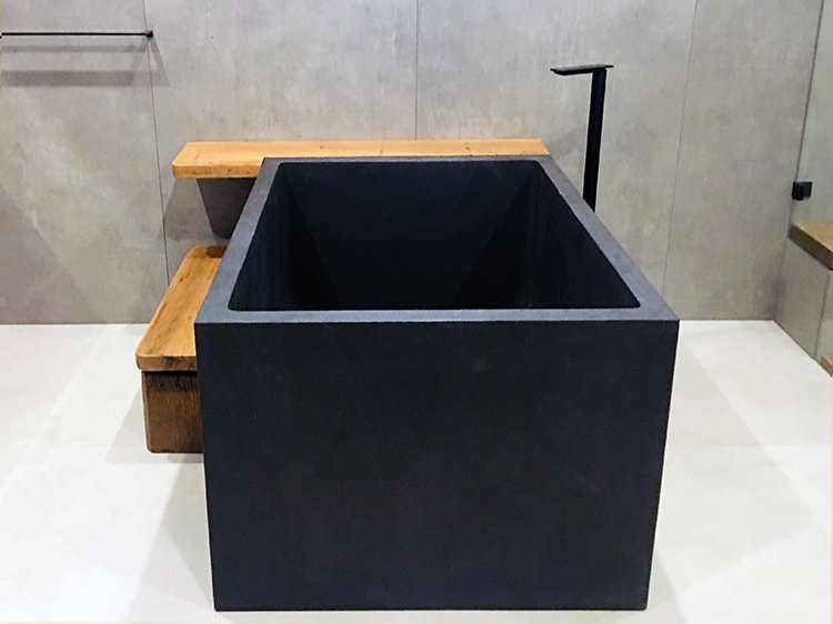 In situ view of our Japanese soaking bath in Stone Composite in pure plain black colour.