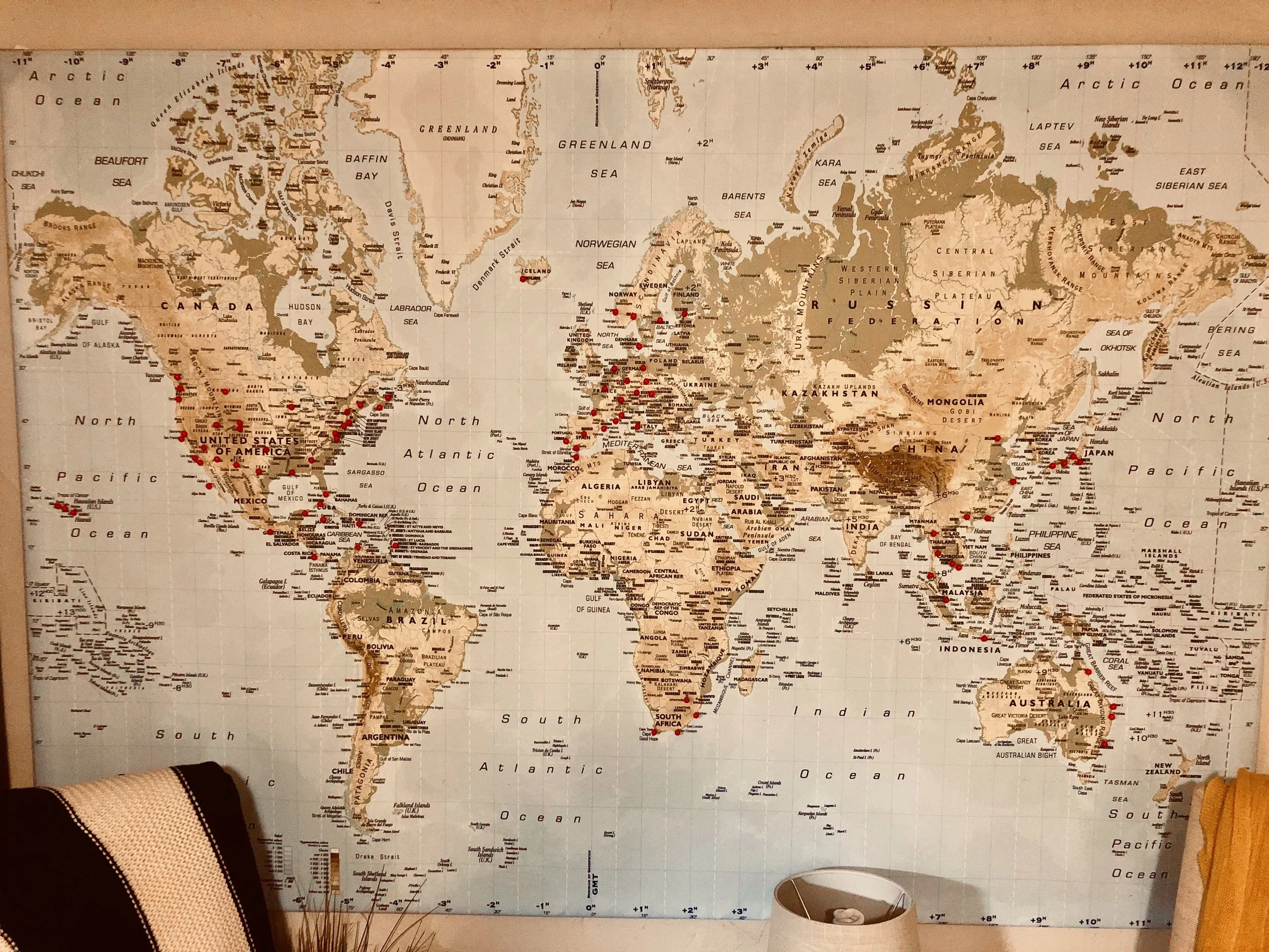 Our living room wall showing everywhere we’ve been!