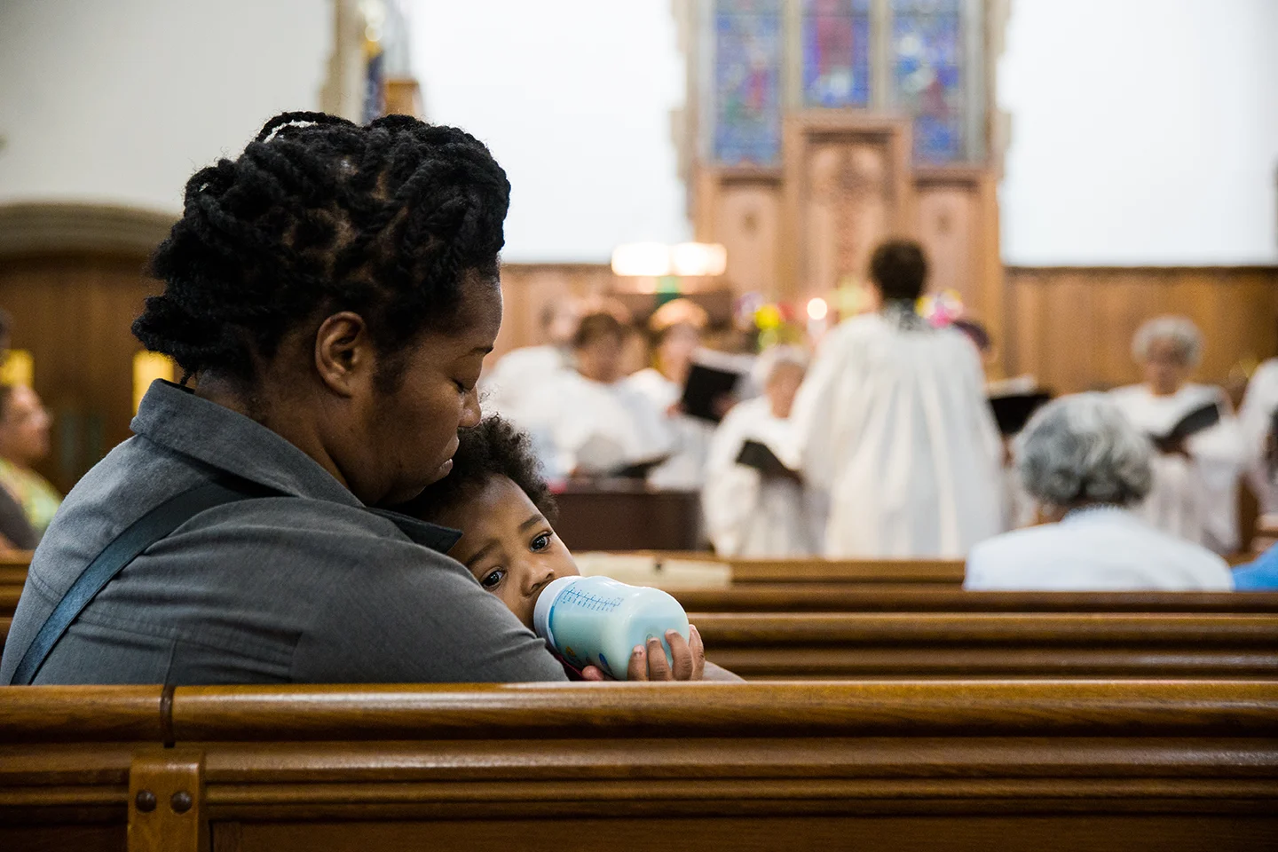A mother holds her child during a worship service at McKendree UMC in Washington D.C.
