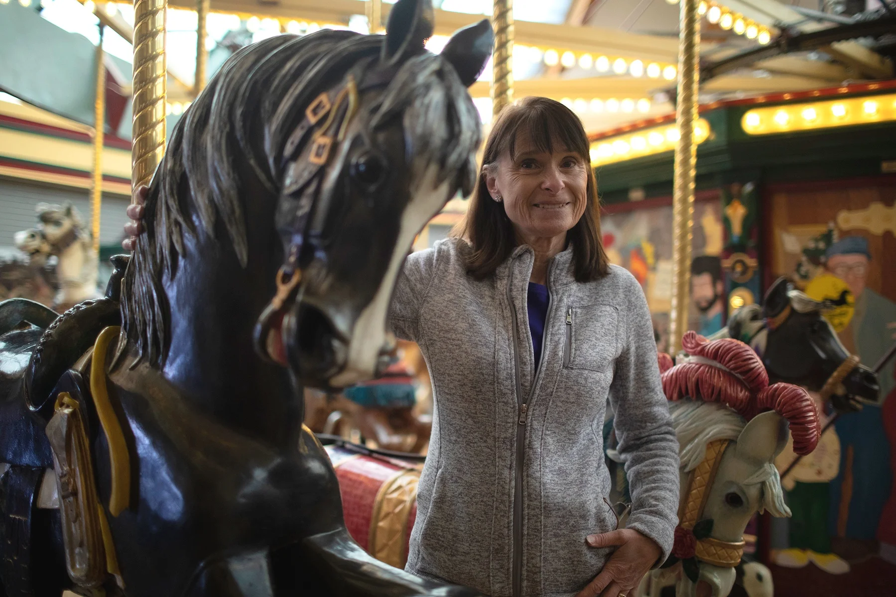 Theresa Cox, FUMC Missoula Building Finance Team Chair, leading a mini tour of Missoula’s carousel.
