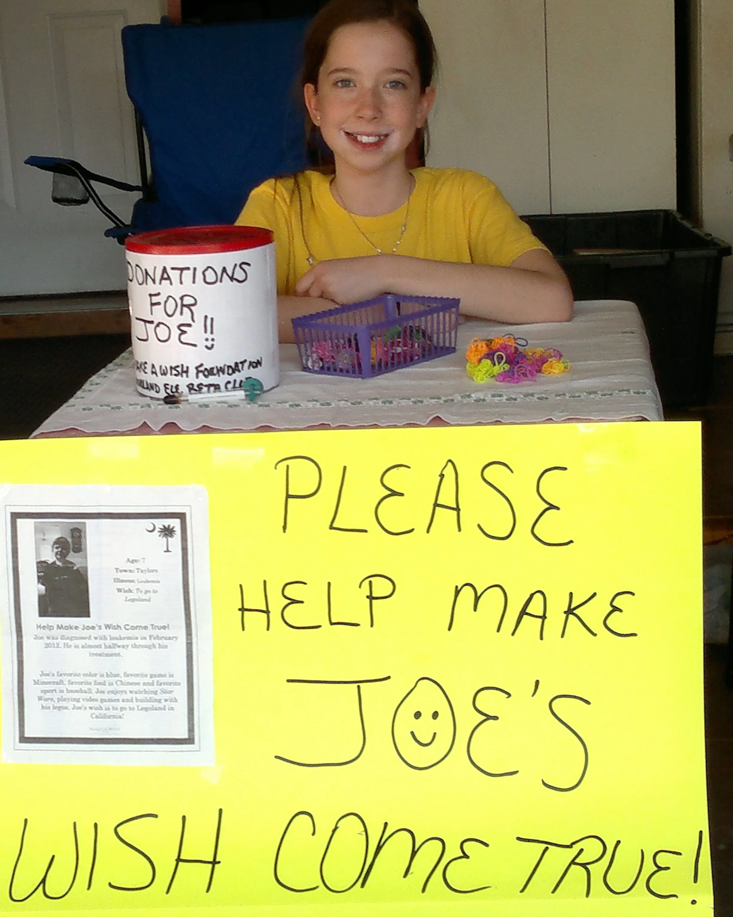Bella with table she set up to raise money for "Joe"- April 2014