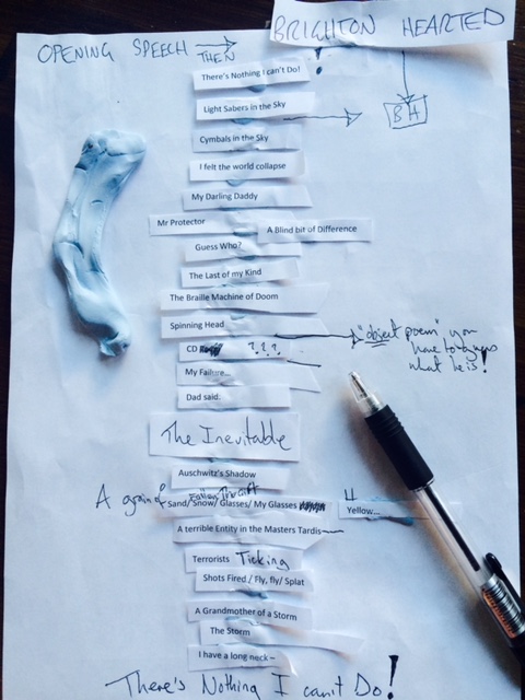 Image Description: Photograph of bits of white paper with handwritten notes stuck in order of the layout of the A Blind Bit of Difference poetry book. Also pictured: A black pen and a blob of Blue Tack