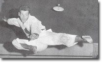 Sensei Ninios, perhaps the most famous picture of him, mid flight in a flying side kick.