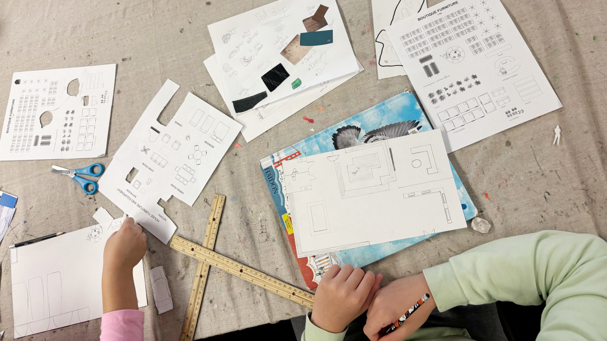 Students drawing and designing floor plans