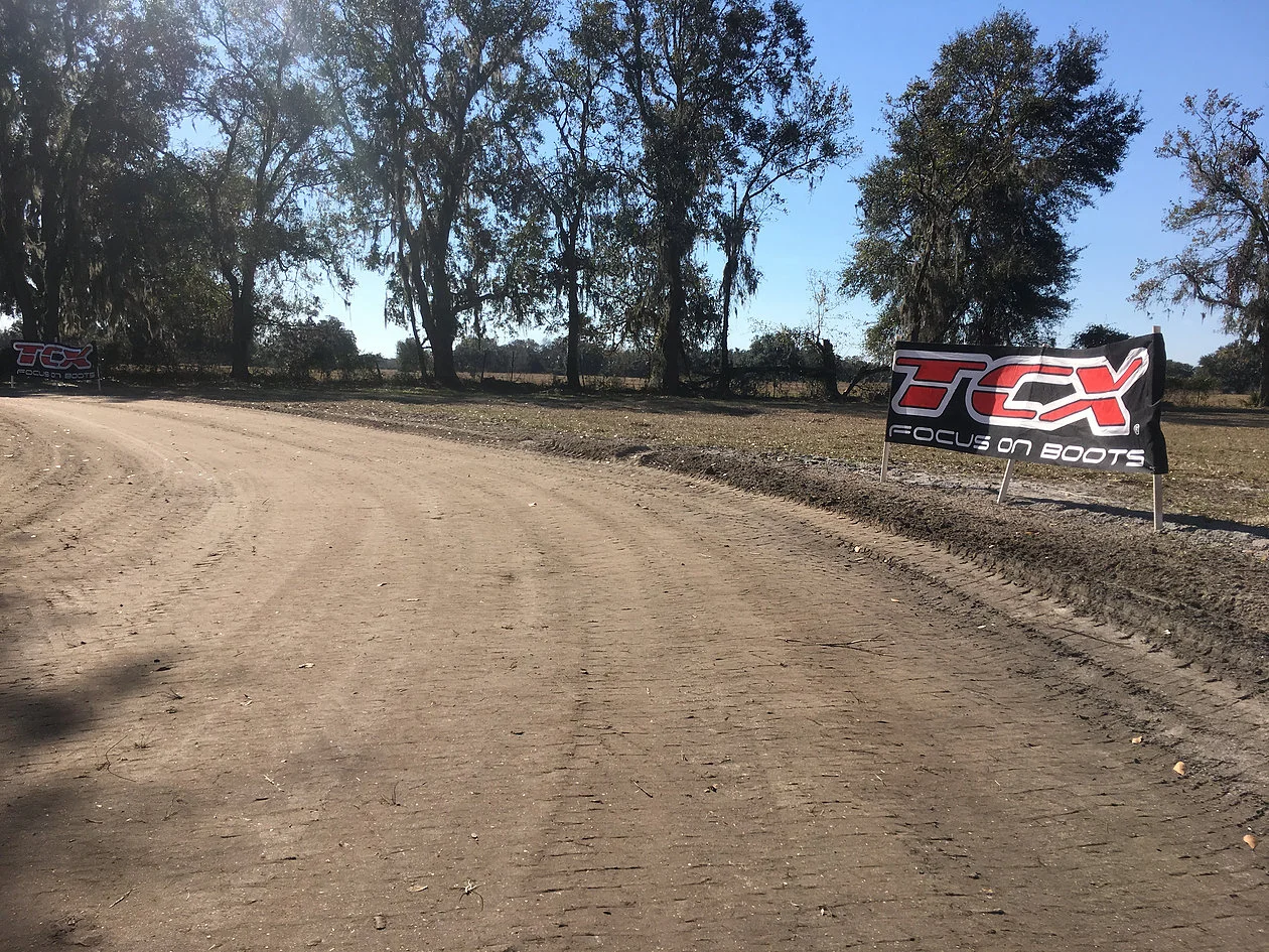  (Exit of turn 2 on the mini short track at 10 Training after preparing again after the rain storm the night before)