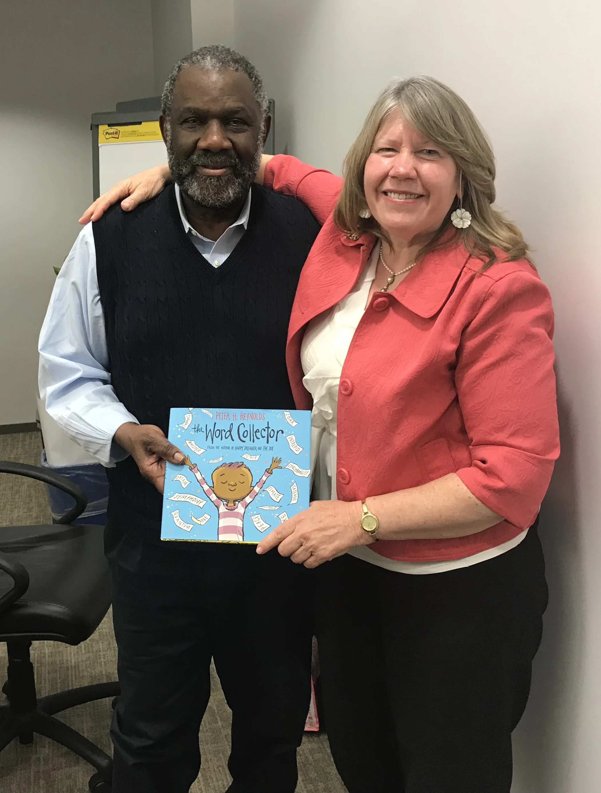 Brigid Hubberman presents Ralph Smith, VP of the Annie E. Casey Foundation, his own copy of the Word Collector.