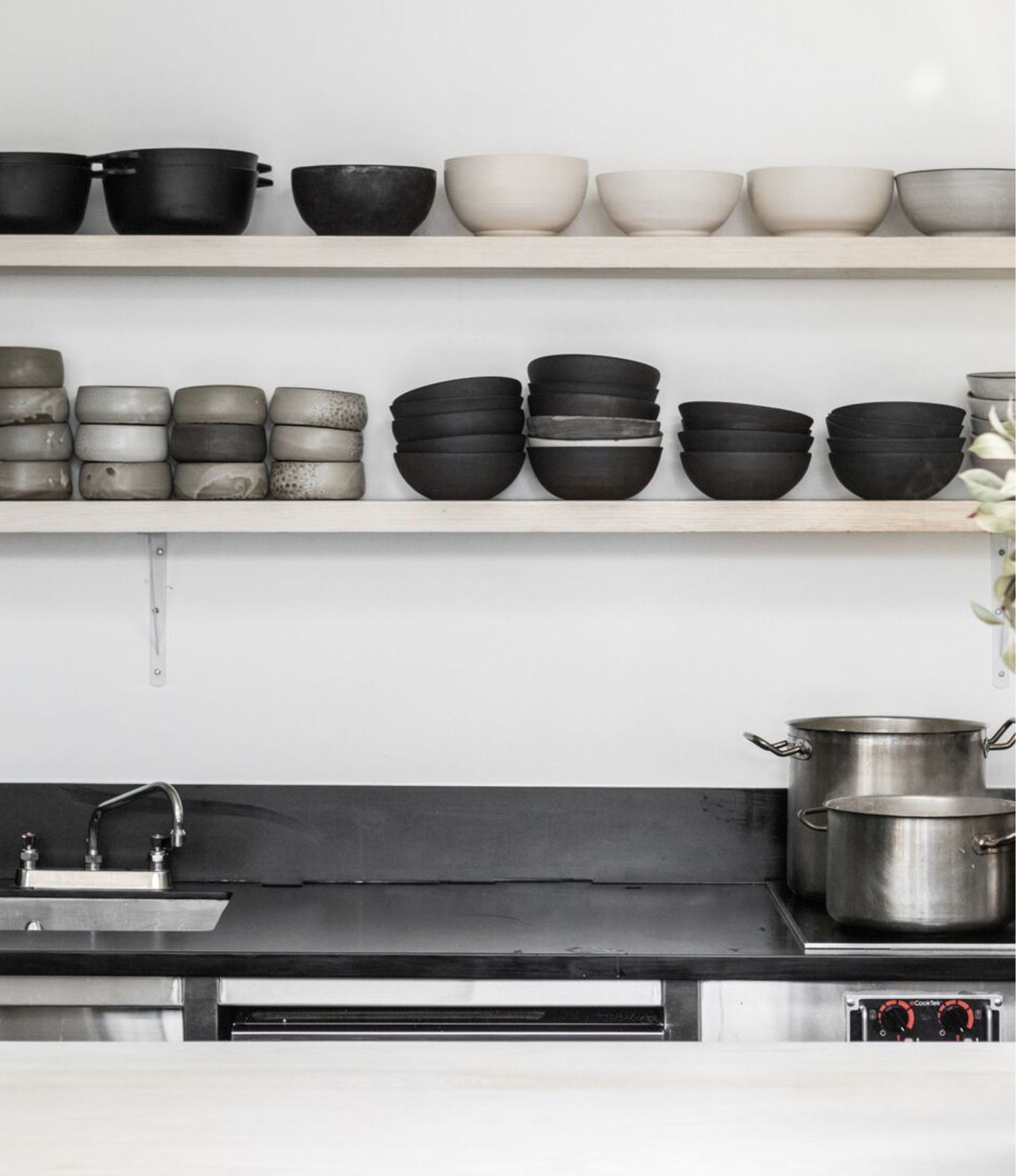 In the food prep areas, Kahn used composite quartz in the food-prep areas. For more on the subject, see Remodeling 101: Engineered Quartz Countertops .