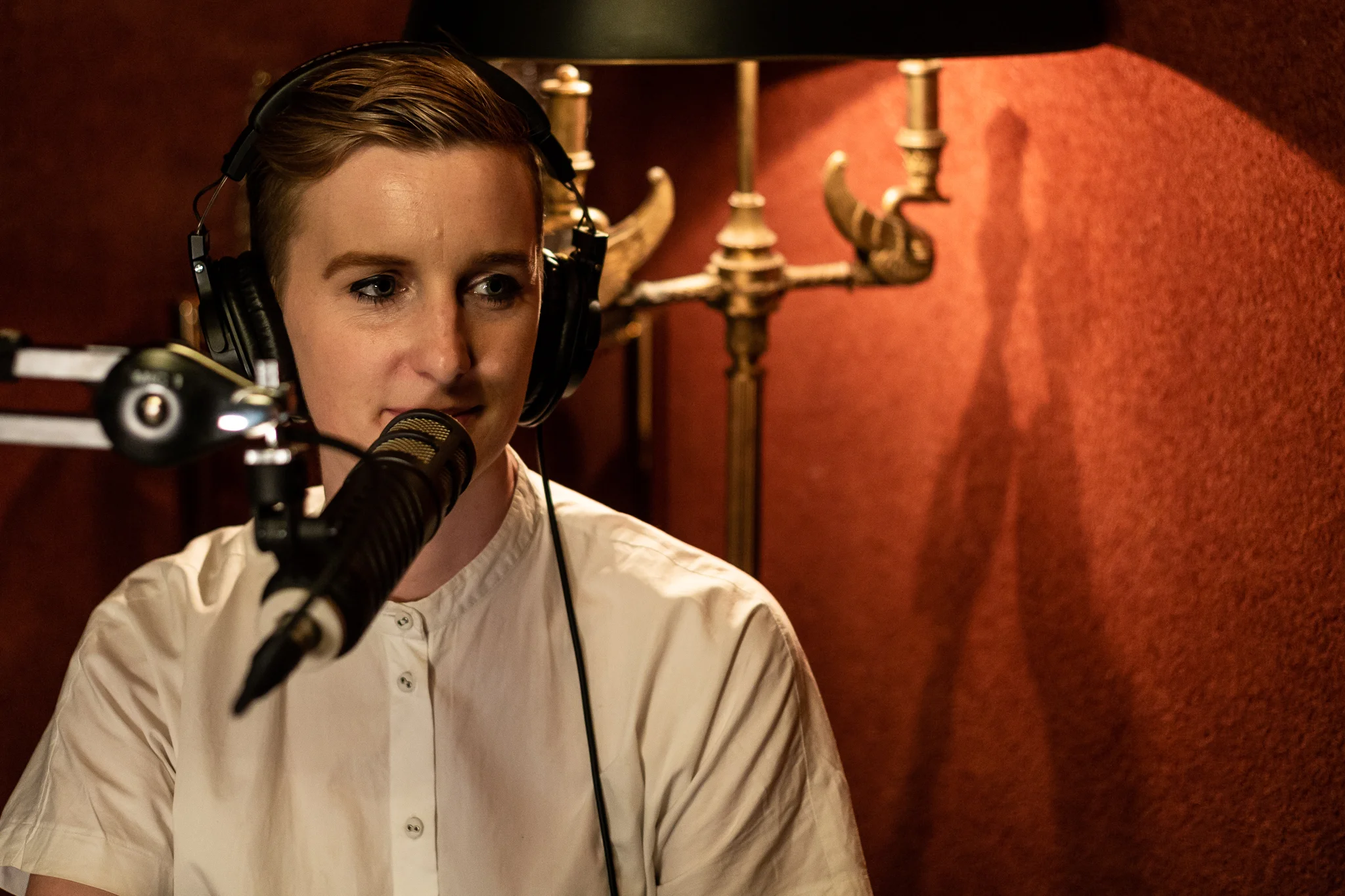 podcast-host-recording-booth-studio.jpg