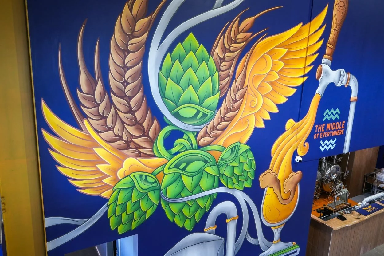 Brevet Brewing floor-to-ceiling brewery mural in Sale, Victoria, created by Melbourne mural artist Lukas Kasper in collaboration with The Middle of Everywhere, featuring aviation-inspired wings and abstract design.