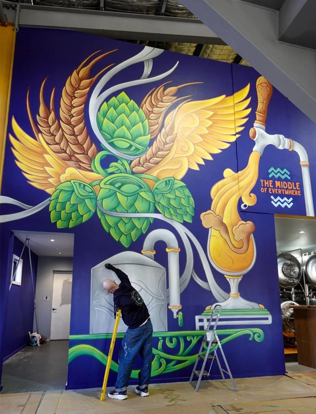 Brevet Brewing floor-to-ceiling brewery mural in Sale, Victoria, created by Melbourne mural artist Lukas Kasper in collaboration with The Middle of Everywhere, featuring aviation-inspired wings and abstract design.