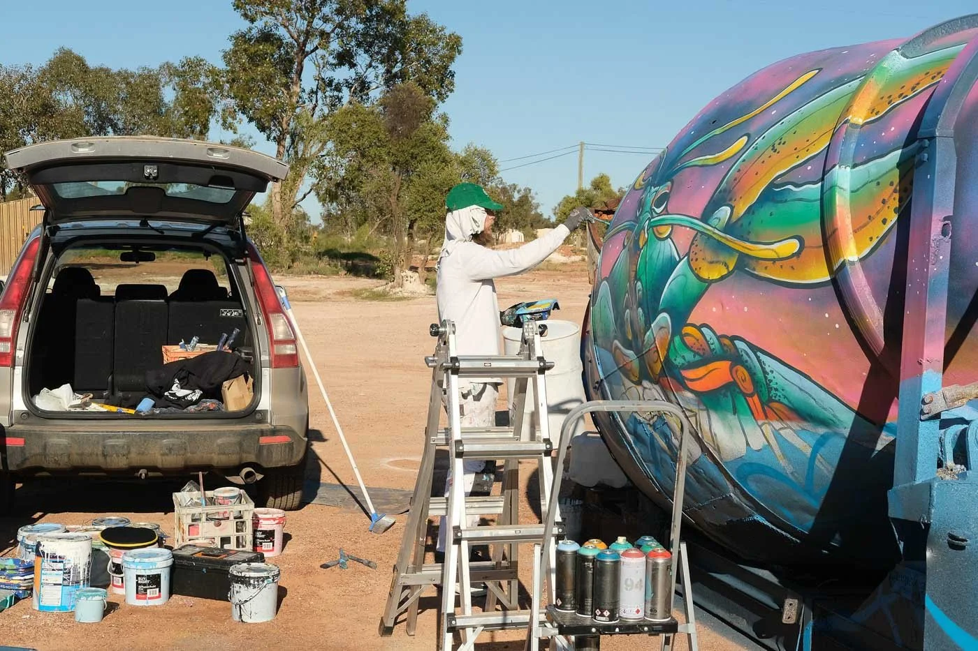 Art Agitators Mural project painted in Lightning Ridge On The Opal Miners Hall Of Fame facilitated by The John Murray Art Gallery found on the Yellow Car Door Tour