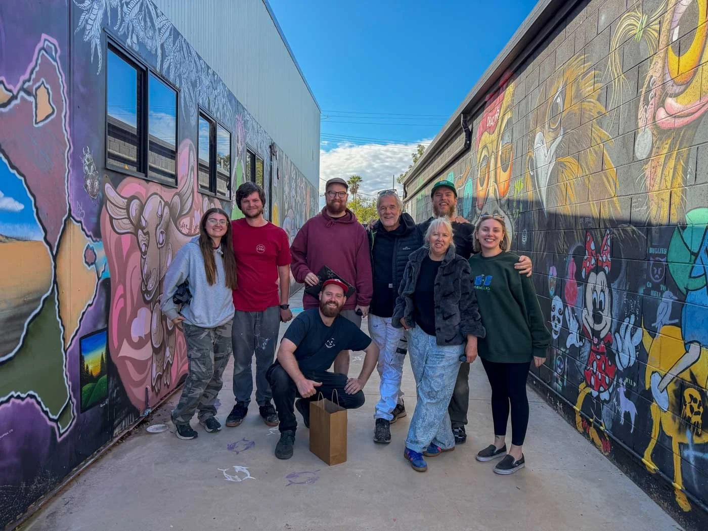 Art Agitators Mural project painted in Lightning Ridge On The Opal Miners Hall Of Fame facilitated by The John Murray Art Gallery found on the Yellow Car Door Tour