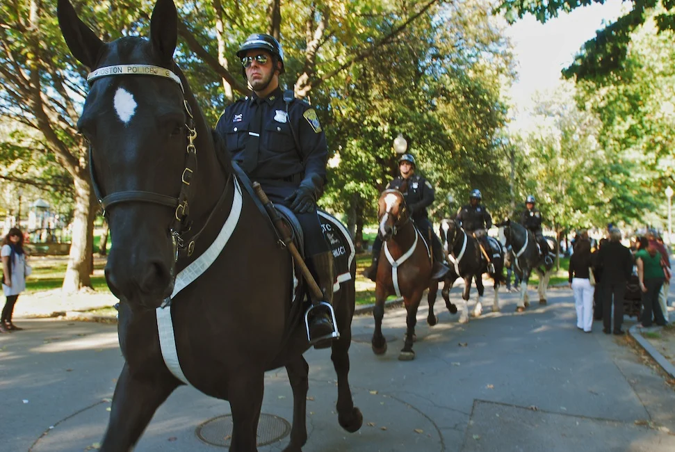 Boston, Mass - Oct. 11, 2008: Police officers mounted on horseback make their way across the Boston Common in anticipation of the anti-war march taking place in downtown Boston. They waited at the entrance of the Common where the march was scheduled to end, though no major violence or arrests were reported. Photo by Andrew Bisdale.