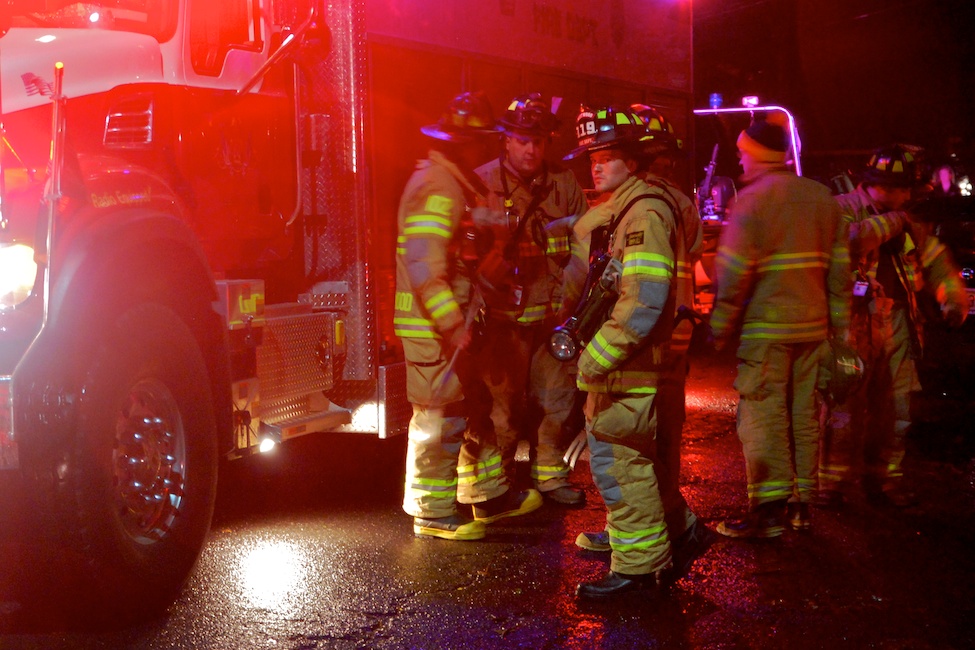  Westwood, NJ - March 7, 2011: Local firefighters prepare to assist residents of flooded homes after heavy rains and an opened flood gate cause a late-night flood.  