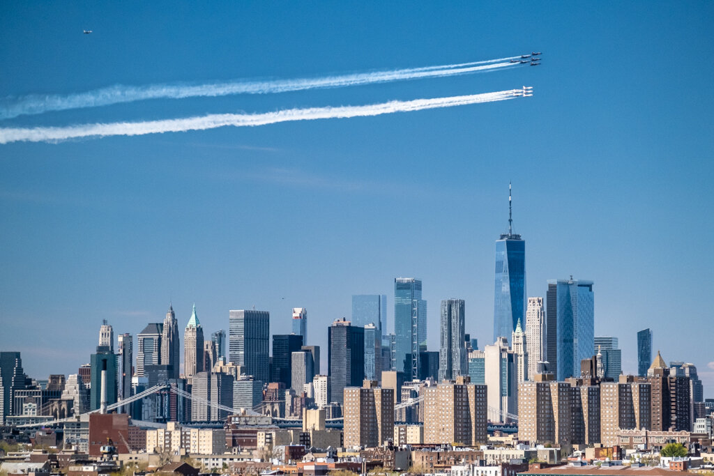  Brooklyn, NY - April 28, 2020: A formation of US Navy Blue Angels and US Air Force Thunderbirds fly over New York City in a salute to first responders of the COVID-19 pandemic. 