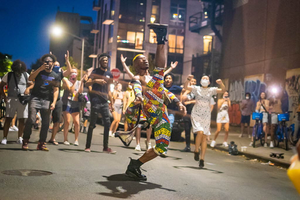  Brooklyn, NY - June 6, 2020: An impromptu dance party takes place underneath the Williamsburg Bridge, featuring a duo of DJ's playing music and gathering passers-by throughout the evening.  Eventually police arrived and the crowd peacefully disperse