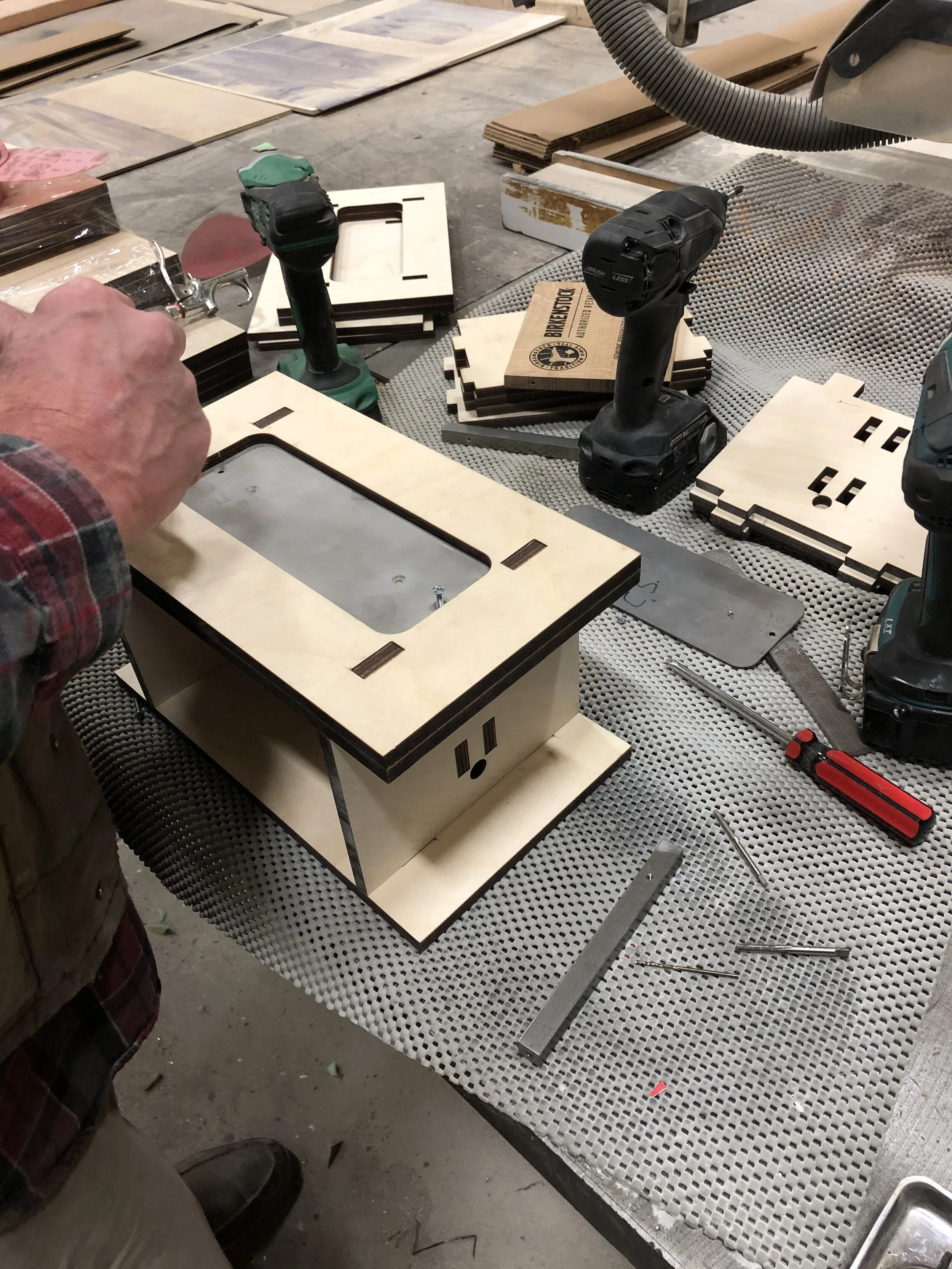   Construction   To help with assembly during mass production we created jigs to make sure all components were aligned and consistent.  
