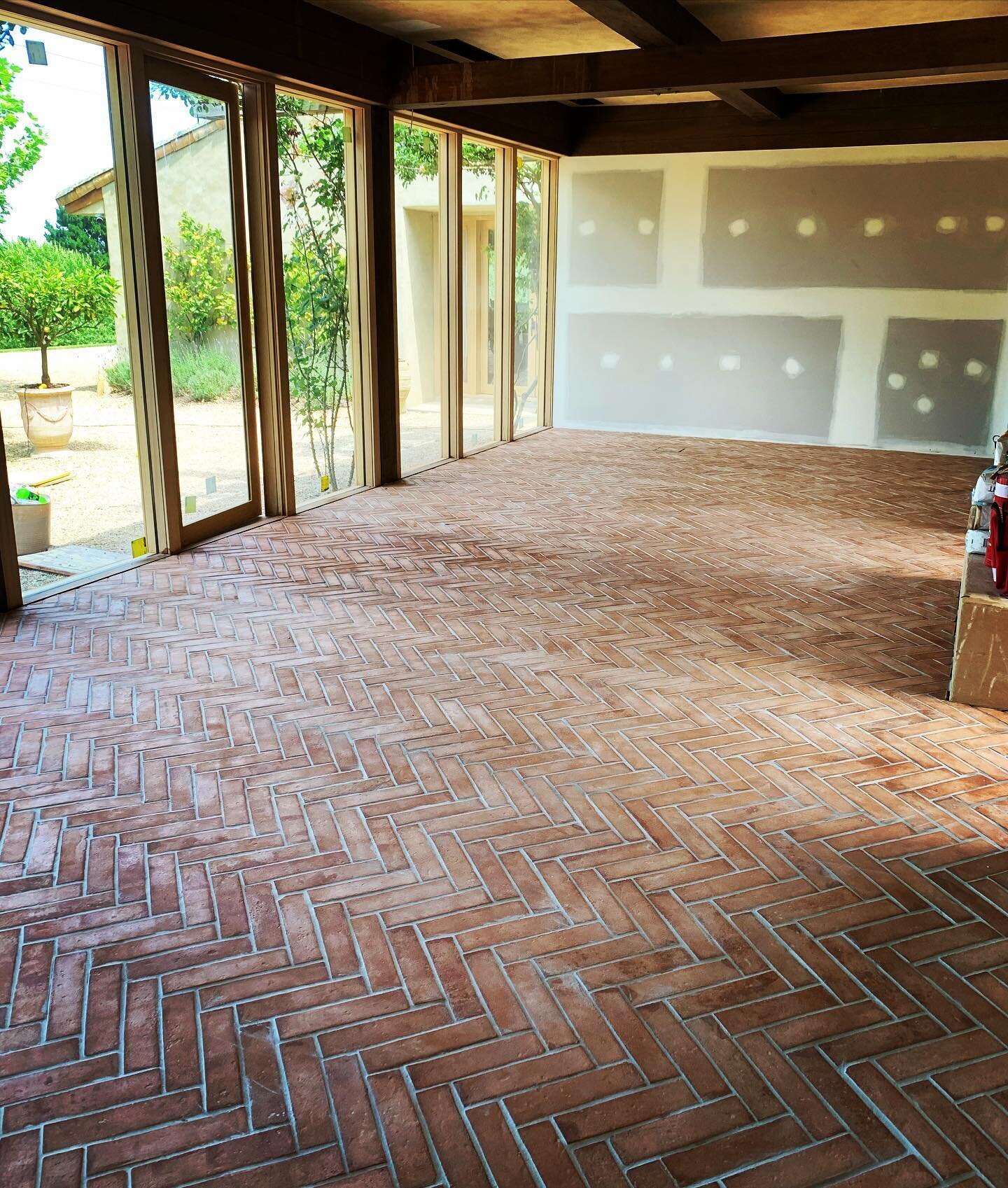 Red Hill Project &bull; 
Rustic style terracotta in a herringbone pattern ✔️