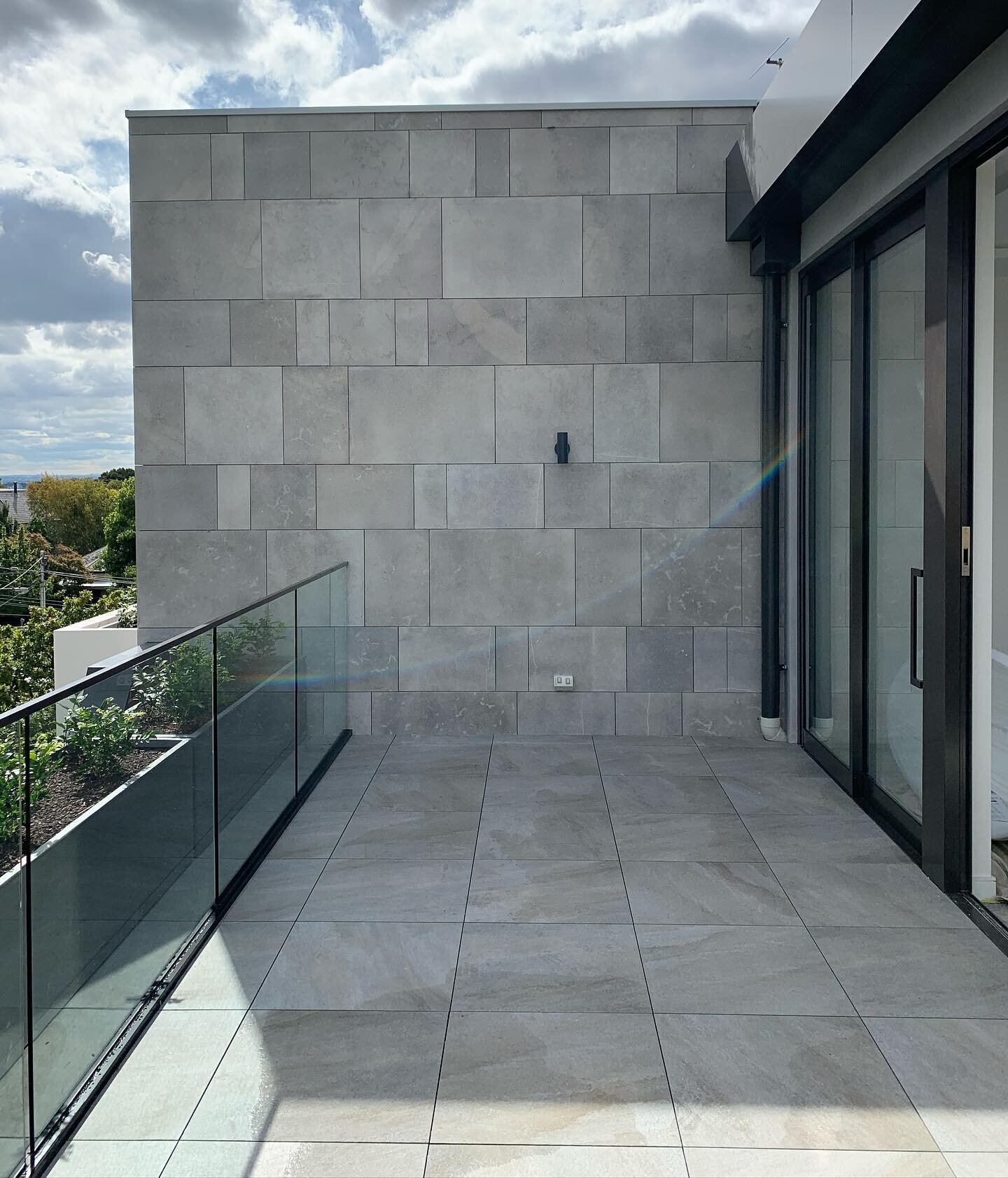 Malvern Rd Project ~ Penthouse balcony looks amazing with our mechanical fixed stone wall and pod and paving system.