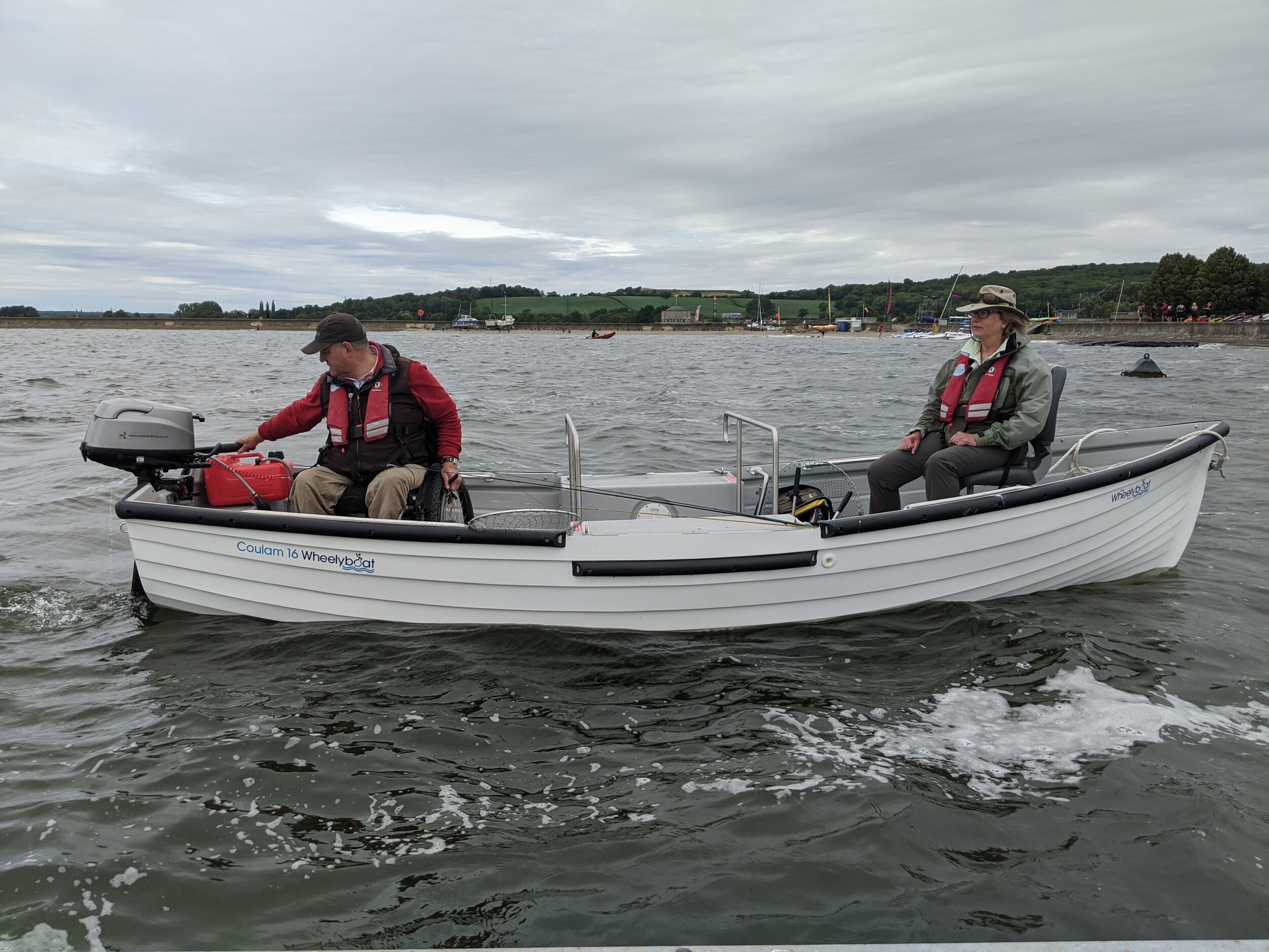 Andy Beadsley and Karen Woolley fishing on Farmoor Reservoir with new C16 Wheelyboat. Credit Thames Water.jpeg