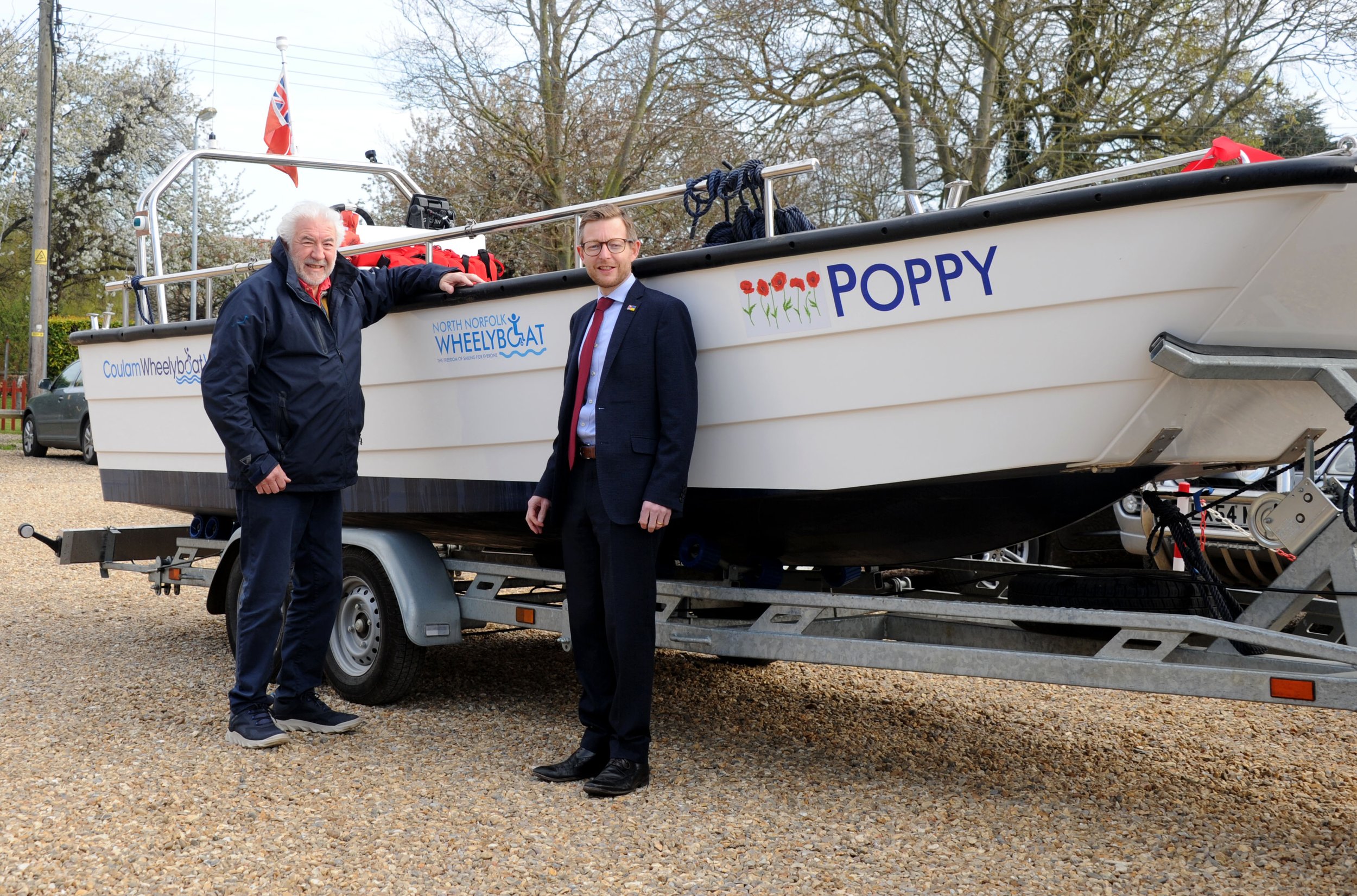 John Pyror (L) and Duncan Baker MP (R) with 'Poppy' the new Coulam V20 Wheelyboat (2). Credit Alban Donohoe.JPG