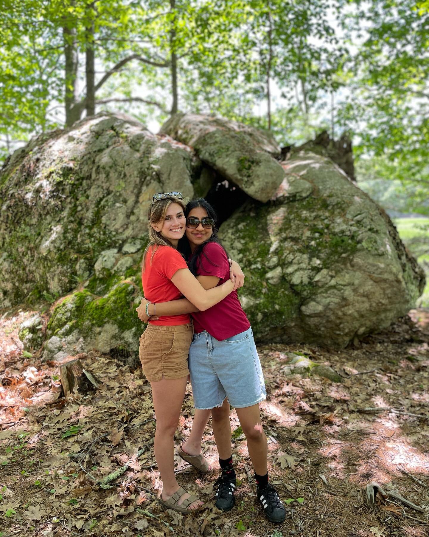 We recently hosted a Good Life Gap Year reunion of Fall 2021 students. Here&rsquo;s two of the reunionees, Lauren and Anoosh, standing in front of a boulder split in two by a tree that grew through it - somehow - to create a cave and a meeting place 
