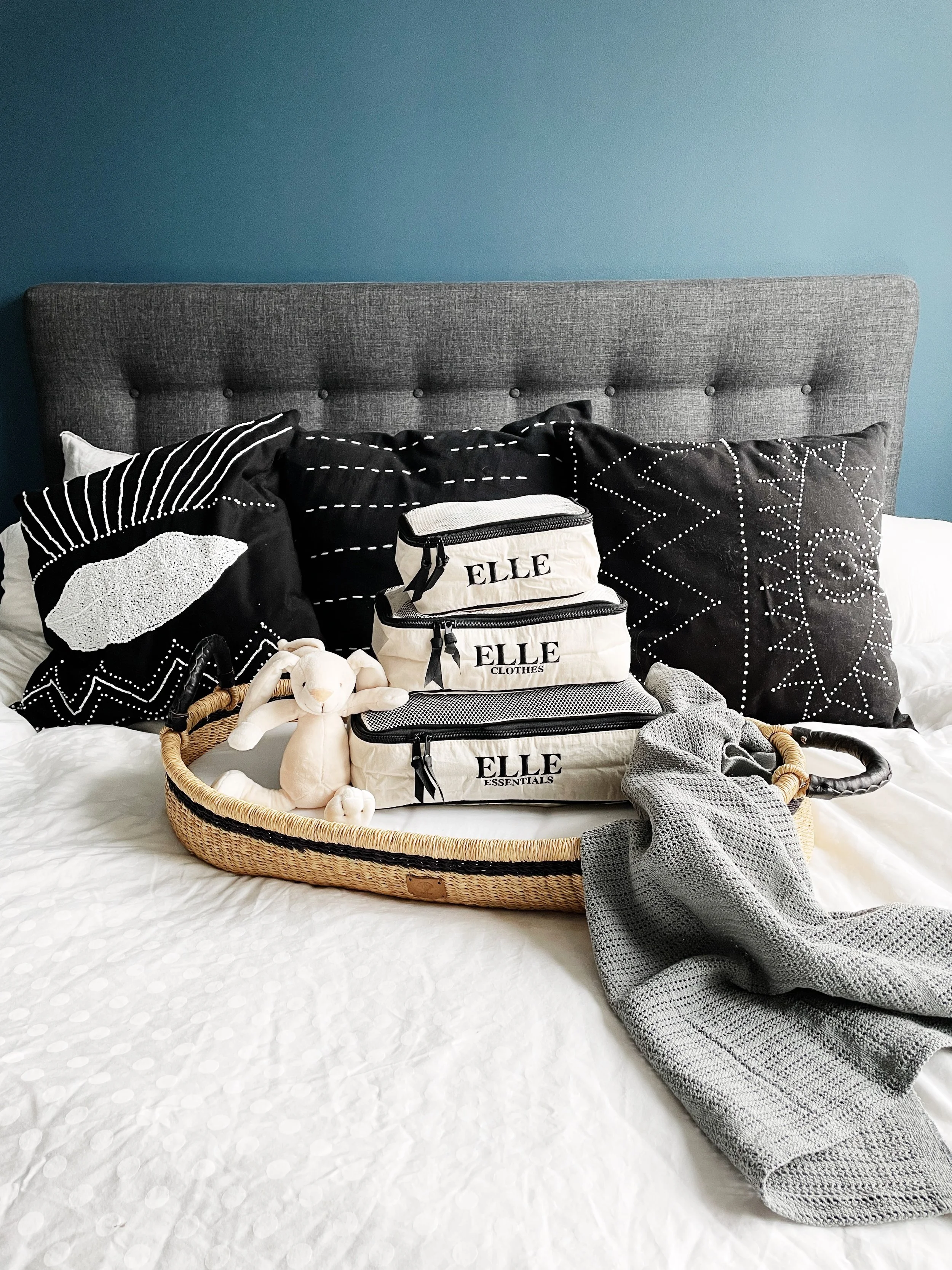 Packing cubes grouped by family member inside suitcase